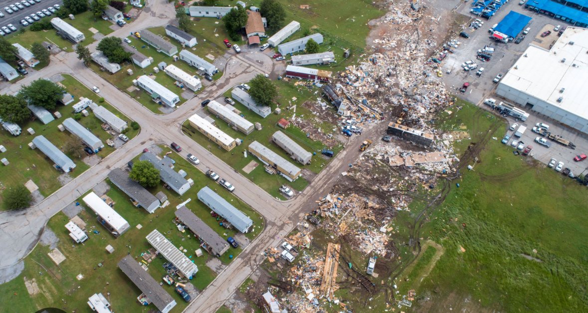 Aerial view of a tornado debris field cutting through a mobile home park